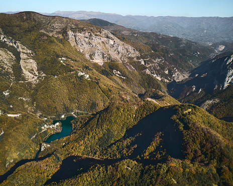 An aerial view of green hills and mountains in Garfagnana, Italy