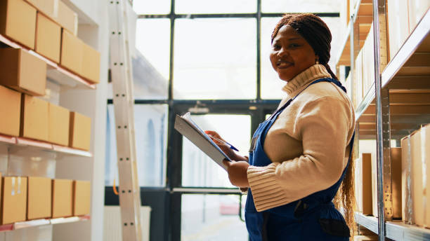istock Female employee checking clipboard list for logistics 1461606313