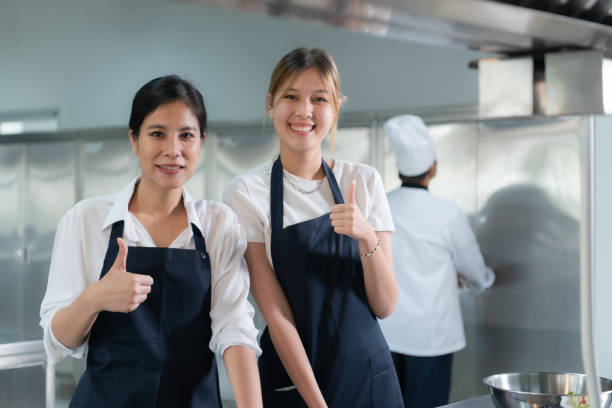 istock Cooking apprentices prepare meals and ingredients before the chef arrives to instruct at the culinary academy's kitchen. 1461608286
