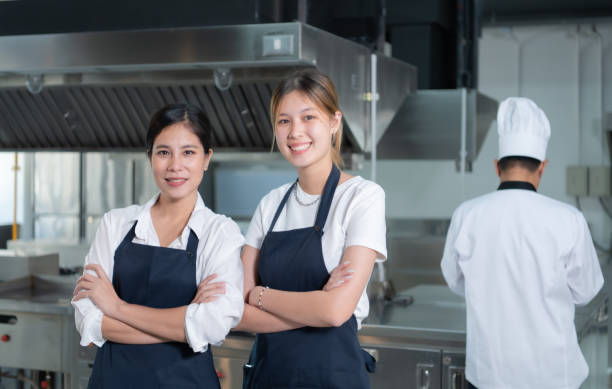 istock Cooking apprentices prepare meals and ingredients before the chef arrives to instruct at the culinary academy's kitchen. 1461608294