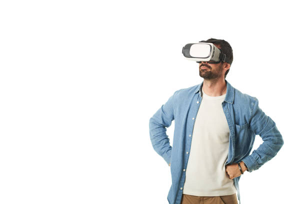 istock a man with virtual reality goggles making hand gestures isolated on a white background 1461609728