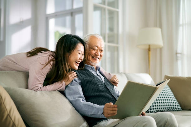 asian elderly father and adult daughter having a good time - senior adult with daughter father imagens e fotografias de stock