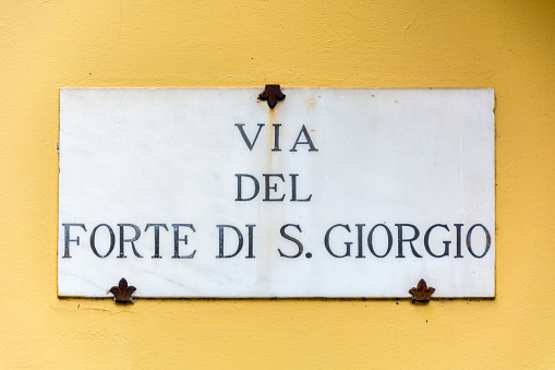 Florence, Italy - MAY 11, 2019: Via del Forte di S. Giorgio  street sign on the wall in Florence, Italy