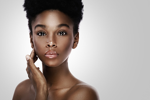 Portrait of young and beautiful black woman with smooth skin