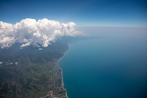 Flying high in the sky, aerial view of the coast