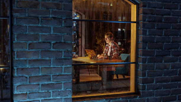 istock Female Specialist Working on Laptop Computer in Stylish Apartment. Creative Professional Managing Corporate Social Media, Browsing Internet. Freelancer Remotely Works From Home. View Through Window. 1461627461