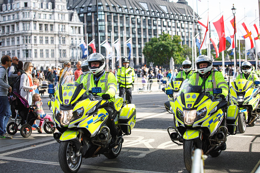 London, United Kingdom - September 18 2022: After the announcement of Queen Elizabeth II. death; motorcycle policemen are in front of Westminster Abbey.