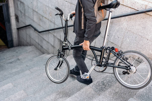 istock Man Carrying Detachable Bike 1461630337