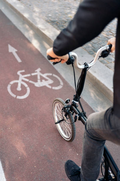 istock Man Using Bike in the Street 1461630353
