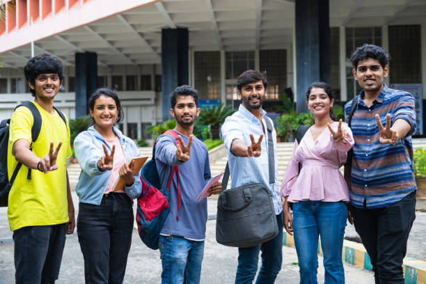 istock group of college students showing victory sign or gesture by looking at camera while standing at college campus - concept of successful placements, strength and cooperation 1461631424