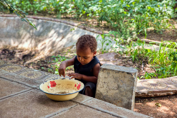 istock african mixed race toddler playing with a bowl 1461634458