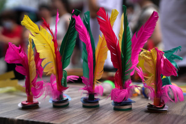 Colourful Feathers Kick Shuttlecocks, Traditional Chinese Jianzi, Foot Sports Outdoor Toy Game Colourful Feathers Kick Shuttlecocks, Traditional Chinese Jianzi, Foot Sports Outdoor Toy Game shuttlecock stock pictures, royalty-free photos & images