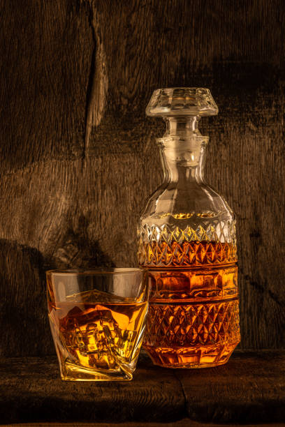 istock Golden alcoholic drink in decanter, bottle and glass 1461642455