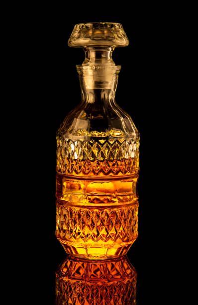 istock Golden alcoholic drink in decanter, bottle and glass 1461642488