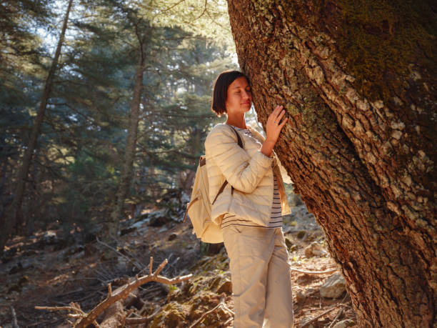 istock woman enjoys nature, beautiful forest in mountains 1461643917