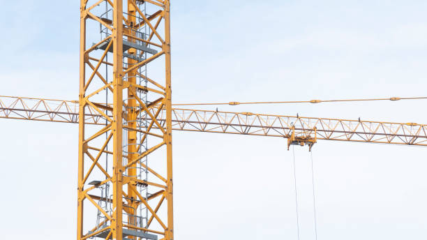 istock Construction crane at work on a busy building site. Construction industry concept. 1461645211