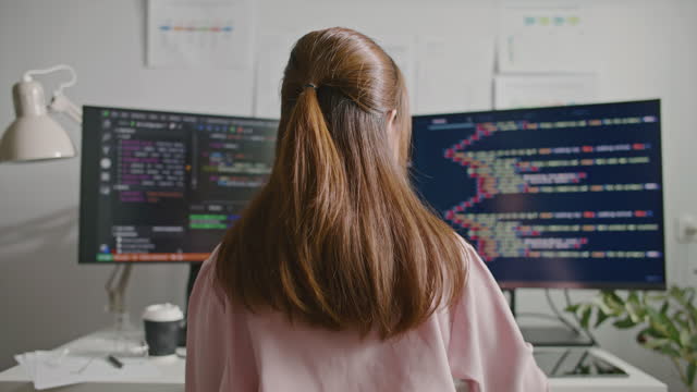 Asian Woman programmer writes code on computer in office, Programmer development