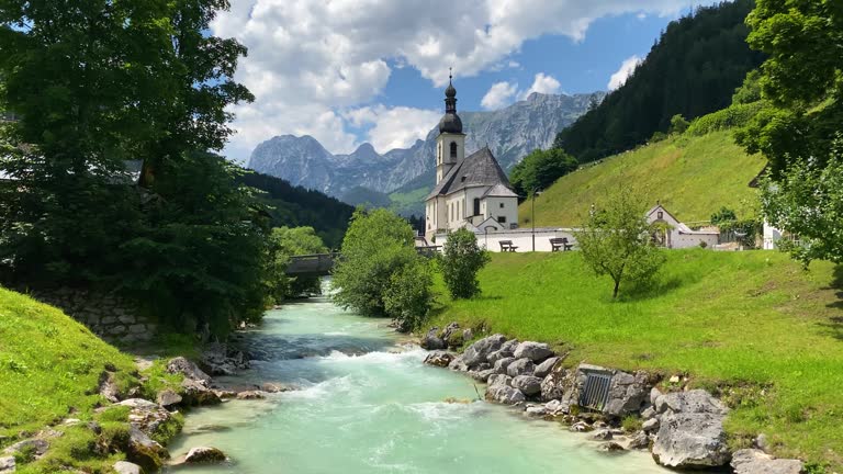 Scenic mountain landscape in the Bavarian Alps with famous Parish Church of St. Sebastian in the village of Ramsau, Nationalpark Berchtesgadener Land, Upper Bavaria, Germany