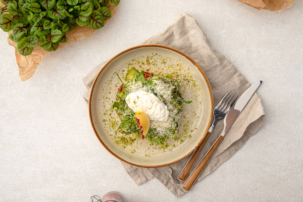istock Portion of avocado salad with tomato and greens 1461647269