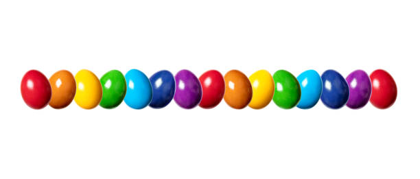 istock Row of slightly twisted, colorful dyed eggs, multi colored eggs 1461649015