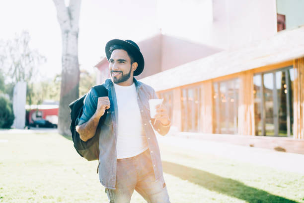 istock Smiling ethnic man relaxing in park 1461653156