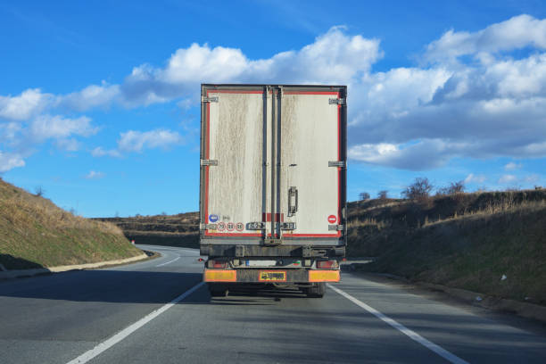 Truck in front of the car.