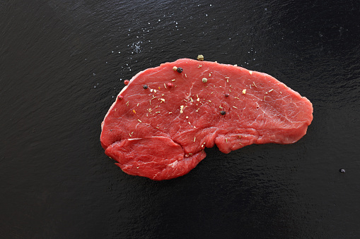 Raw Fillets Steak under preparation for grill