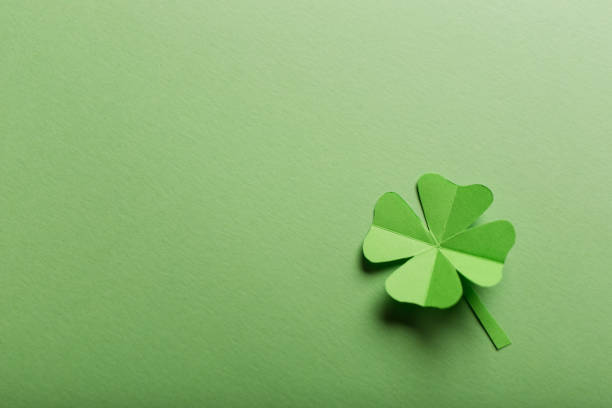istock St. patrick's day. green background with clover leave four-leafed. copy space. Paper craft 1461654713