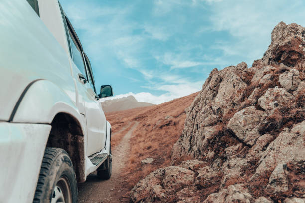 istock SUV stands in a mountainous area 1461654809