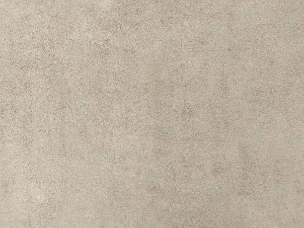 istock An old plaster cement wall, beige abstract background. Concrete grunge texture. 1461657657