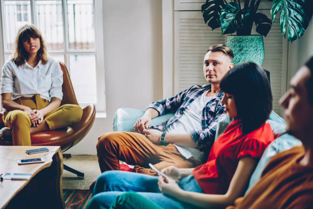 istock Trendy millennial students relaxing together in light contemporary lobby 1461657830
