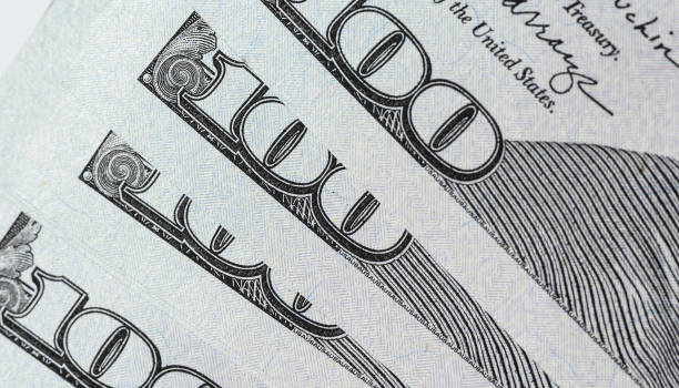 istock Fragment of paper hundred dollar bills 1461658590