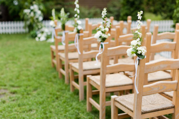 istock Wooden chairs with flowers wedding ceremony 1461658764