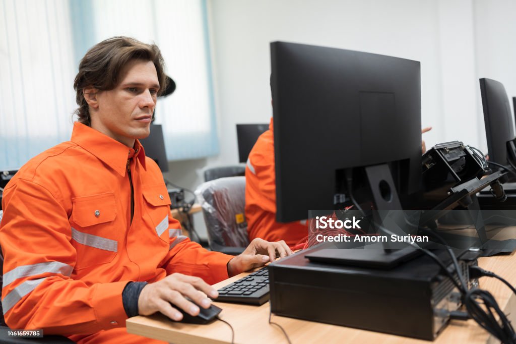 Team Male Engineers Using Desktop Computer Training Programmable Logic ...