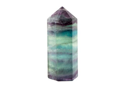 Translucent purple and green color Fluorite crystal standing point gemstone isolated on white background. Healing and clearing energy concept.