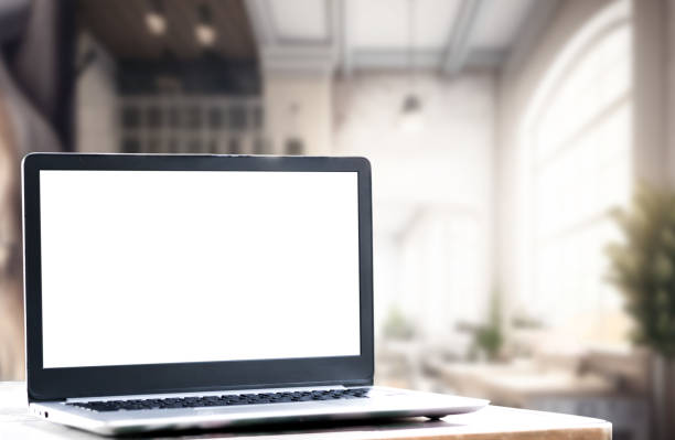 istock Laptop computer on desk at office or co-working space, Laptop with white blank on screen and blurred background , working space concept. 1461663566