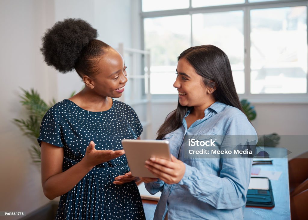 Discuss Work Two Women Discuss Work Solutions In Boardroom Office With Tablet ...