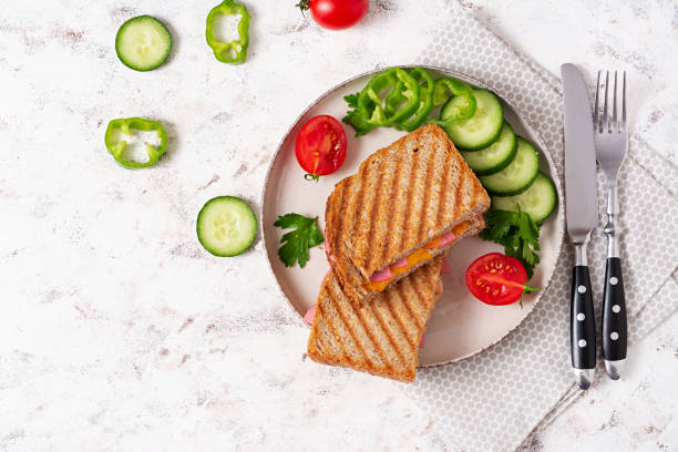istock Club sandwich panini with ham and cheese. Top view 1461665781