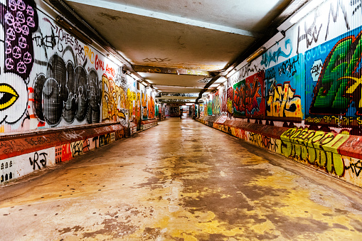 Lisbon, Portugal - November 02, 2022: colorful graffiti on the wall in a subway station in Lisbon
