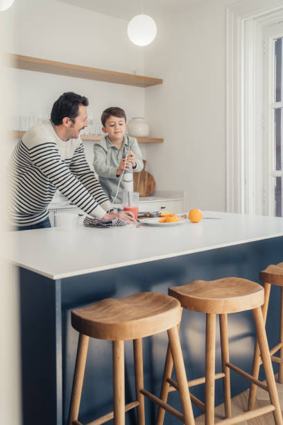istock Family preparing smoothies in the kitchen 1461672083