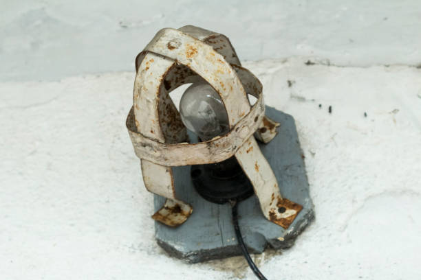 istock Outdoor incandescent lamp in a protective anti-theft cage 1461672449
