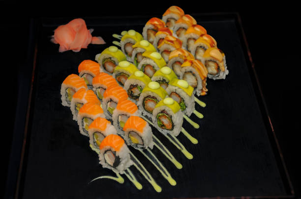 sushi rolls on a black background. sushi menu. japanese food - japanese cuisine temaki sashimi sushi imagens e fotografias de stock