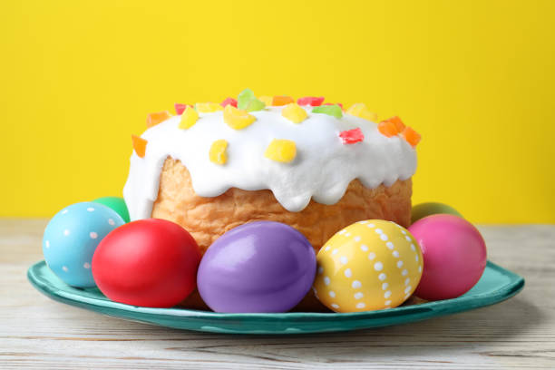 istock Easter cake and colorful eggs on white wooden table 1461675534