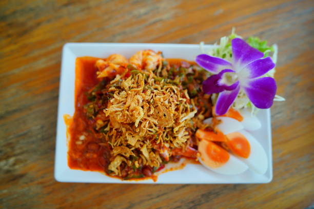 Spicy salad or spicy winged bean salad with shrimp and egg