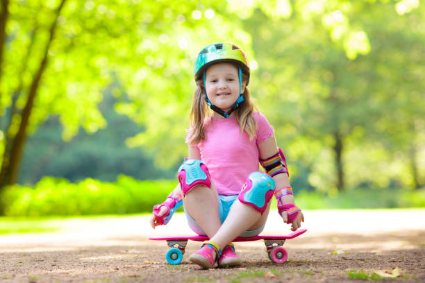 istock Child riding skateboard in summer park 1461679967