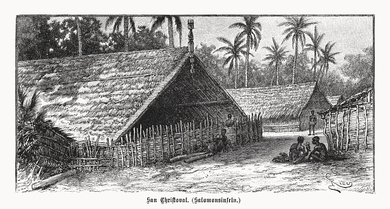 Historical view of native dwellings of San Cristobal, also called Makira Island, formerly San Cristoval - island in the country of Solomon Islands, southwestern Pacific Ocean, 40 miles (64 km) southeast of Guadalcanal. Wood engraving after a drawing, published in 1899.