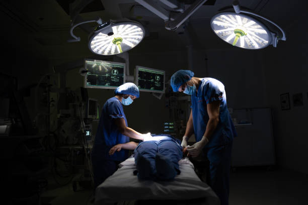 istock Nurses in the operating room preparing a patient for surgery 1461681599