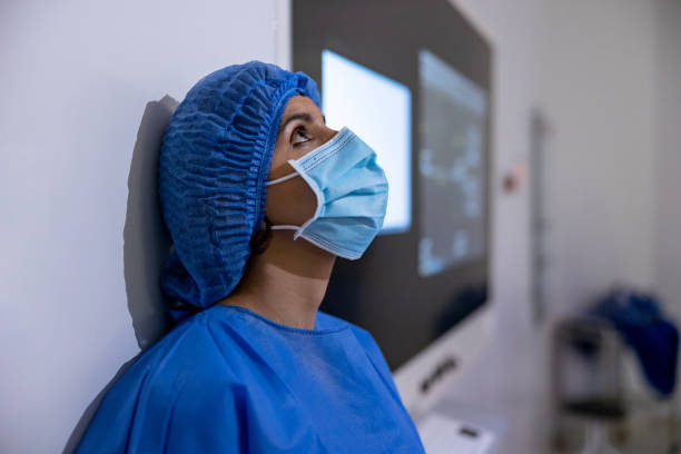 istock Tired surgeon outside the operating room looking frustrated 1461681772