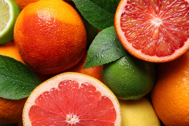 istock Different ripe citrus fruits as background, closeup 1461681830