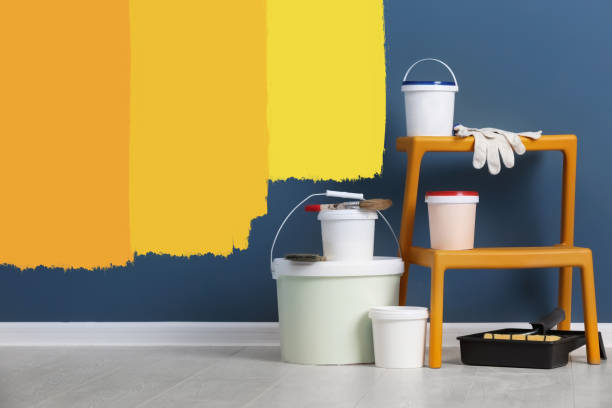 istock Set with decorator tools and paint on floor near color wall 1461683014
